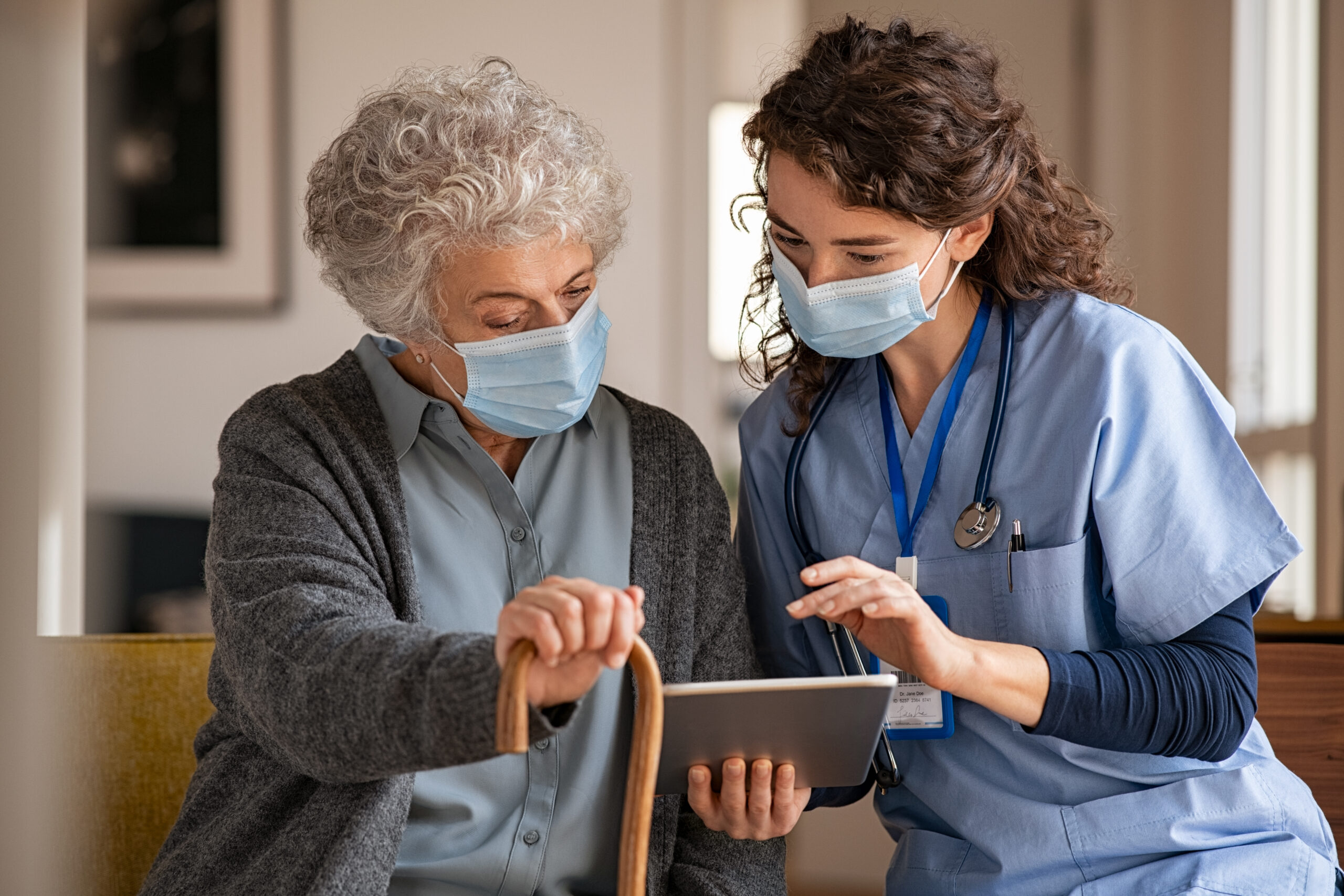 Caregiver assisting a senior at home - in-home care referrals for hospital discharge planners and case managers